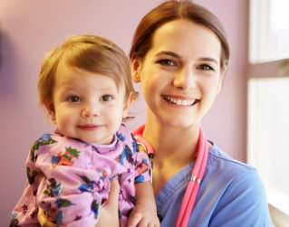 pediatrician and child smiling