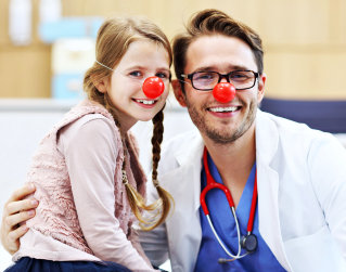 male doctor and a child smiling