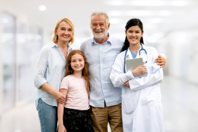 medical professional and a family smiling