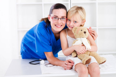 nurse and a kid smiling
