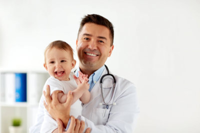 doctor and a kid smiling